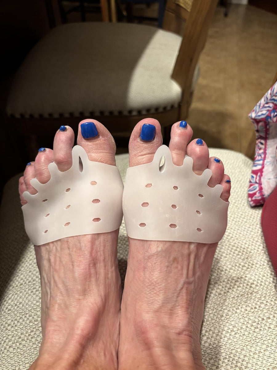 Customer using the toe straightener at home